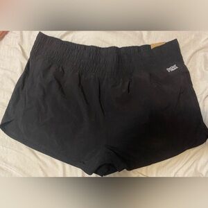 Hello. This is an athletic pair of PINK shorts. They are black and size XXL.